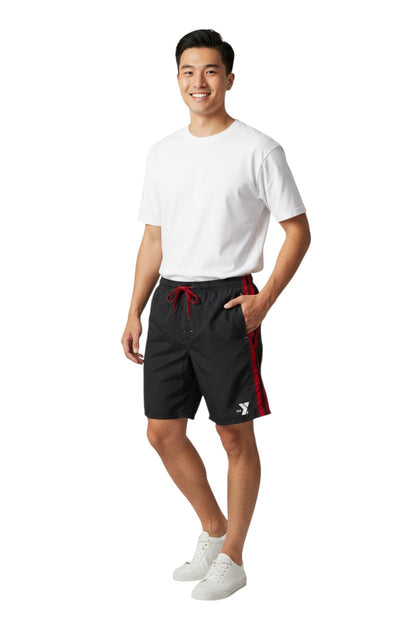 The Lifeguard Store black polyester board shorts with red side stripes and YMCA logo. Elastic waistband, drawstring, and velcro pocket.