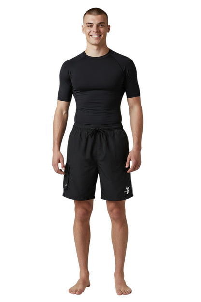 The Lifeguard Store YMCA black polyester board shorts with elastic waistband, drawstring, cargo pocket, and white logo.