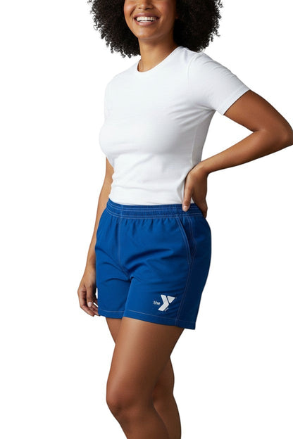 The Lifeguard Store YMCA blue polyester-spandex board shorts with 3" inseam, elastic waistband, and side pocket.