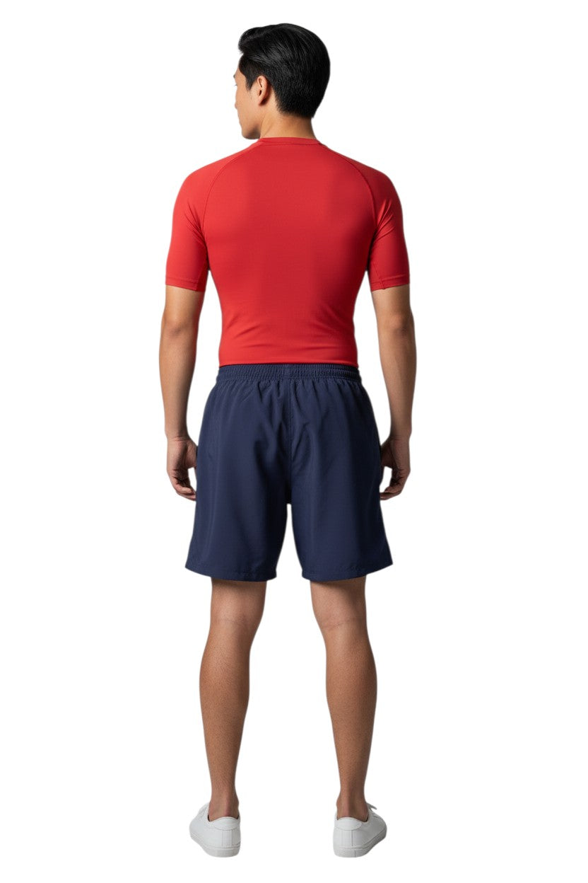 The Lifeguard Store YMCA Boardshort in navy blue, made of sanded polyester with an elastic waistband and drawstring. Features a 7" inseam and velcro pocket.