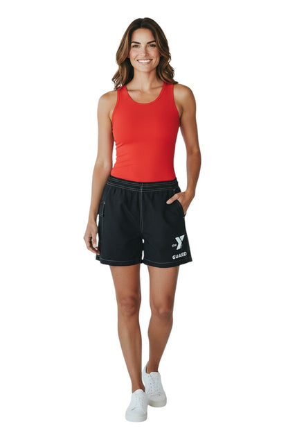 The Lifeguard Store YMCA Guard black polyester-spandex board shorts with elastic waistband and side pocket.