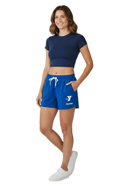 The Lifeguard Store blue polyester YMCA Guard Roll shorts with elastic waistband, drawstring, and pockets.
