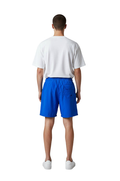 The Lifeguard Store blue sanded polyester YMCA Instructor boardshorts with elastic waistband and velcro pocket. 7" inseam.