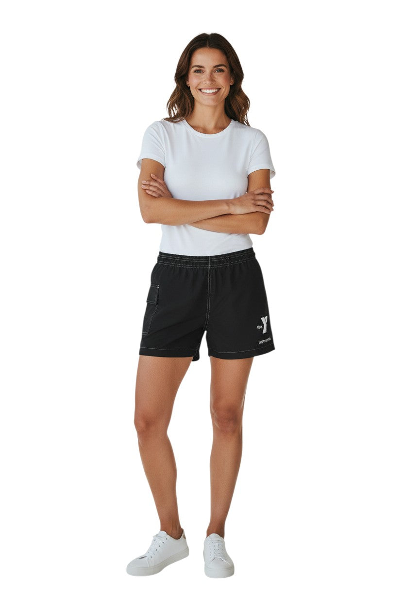 The Lifeguard Store black polyester-spandex board shorts with elastic waistband, side pocket, and YMCA Instructor logo.