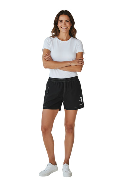 The Lifeguard Store black polyester-spandex board shorts with elastic waistband, side pocket, and YMCA Instructor logo.