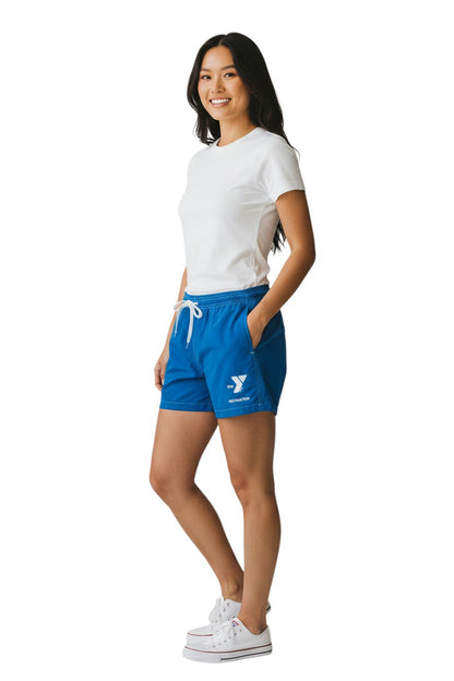 The Lifeguard Store blue polyester-spandex board shorts with elastic waistband, drawstring, and side pocket featuring YMCA Instructor logo.