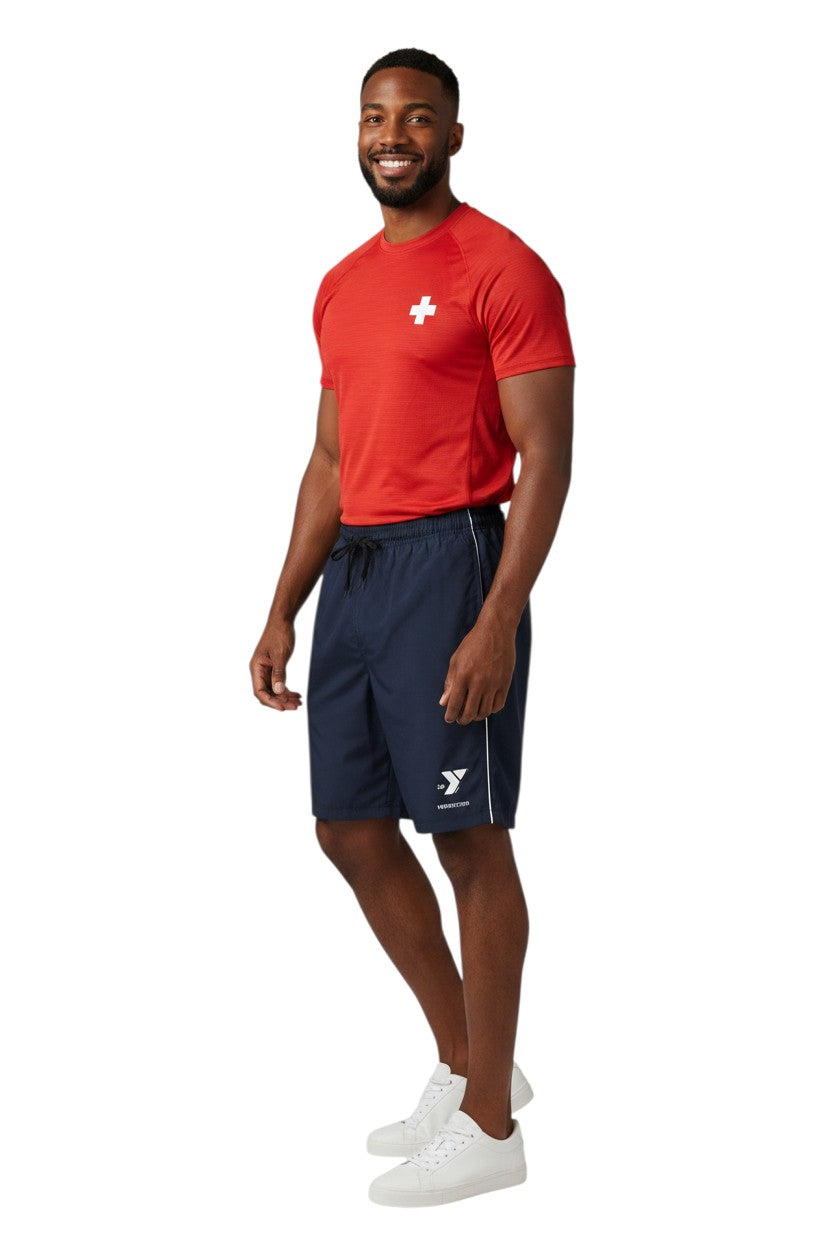 The Lifeguard Store YMCA Instructor Boardshort in navy blue polyester with white piping and logo. Features elastic waistband, drawstring, and velcro pocket.