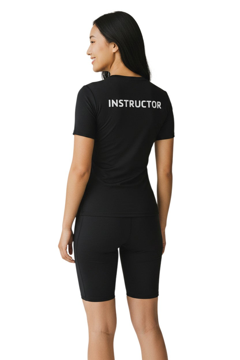 The Lifeguard Store YMCA Kiefer Instructor black short-sleeve rashguard made of polyester and spandex with UPF50+ protection.